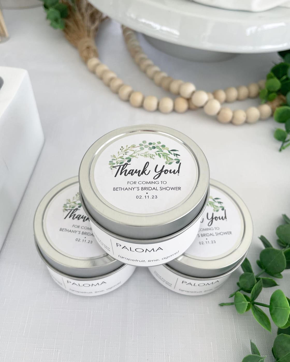 Custom-labeled thank-you candle favors for a bridal shower
