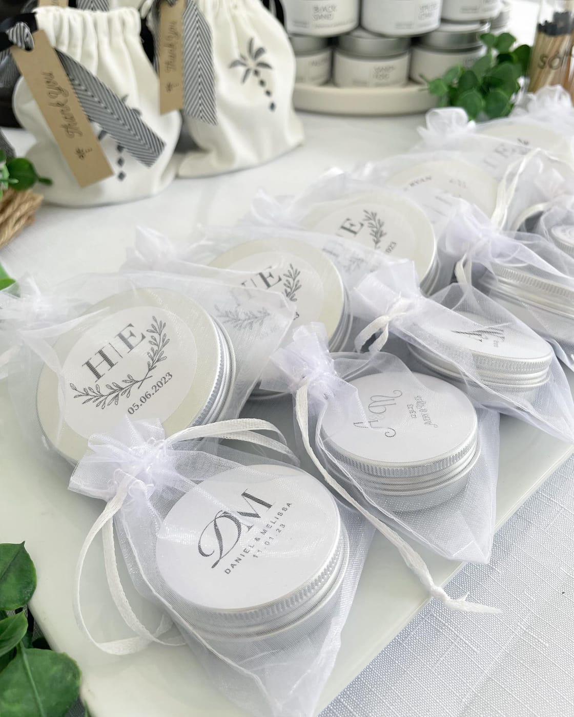 Monogrammed mini candle favors in organza bags