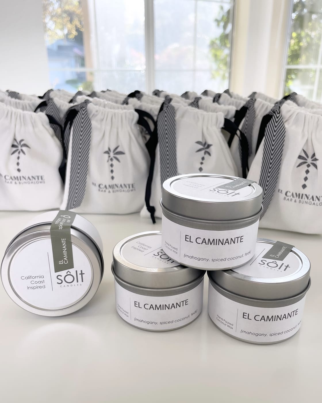 Custom El Caminante branded candles and bags
