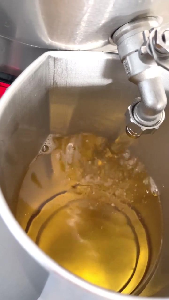 Coconut wax melting in the pouring pot at the Sôlt studio